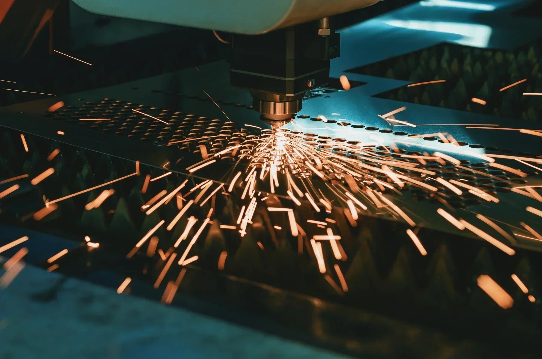 Fiber laser cutting sheet metal with sparks